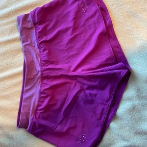Purple athletic shorts w/ liner.